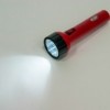 Фонарь светодиодный аккумуляторный ручной 9+3LED 0 7Вт со встроенной вилкой для зарядки красный TL042